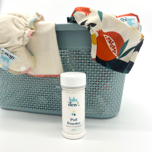pail powder and basket of cloth diapers draped over the basket