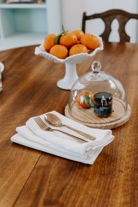 Reusable kitchen towel on dining table with silverware