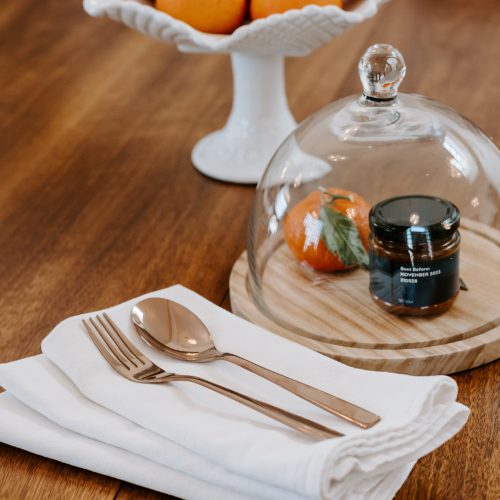 Reusable kitchen towel on dining table with silverware