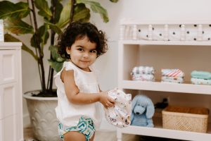 Toddler holding Luludew diaper