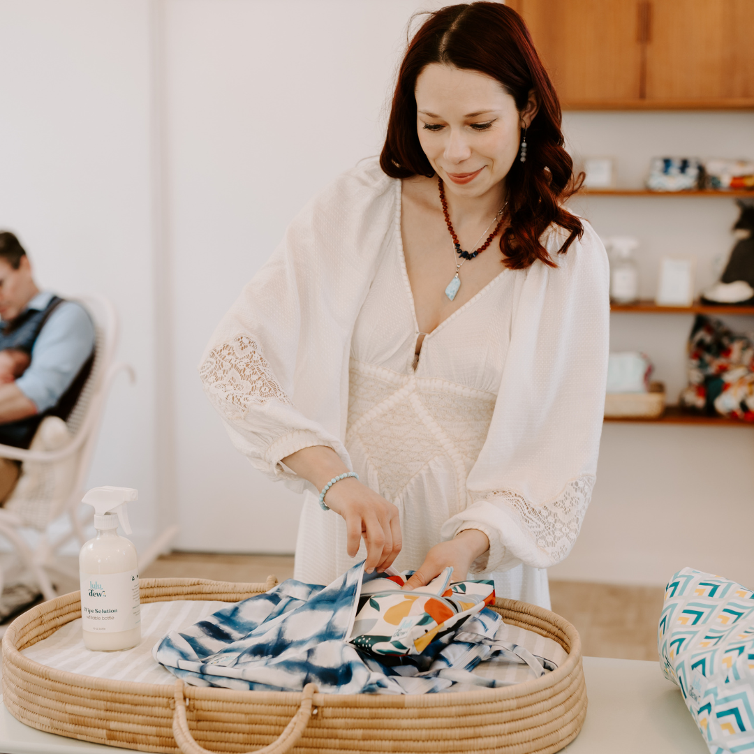 mom putting cloth diapers in a bag